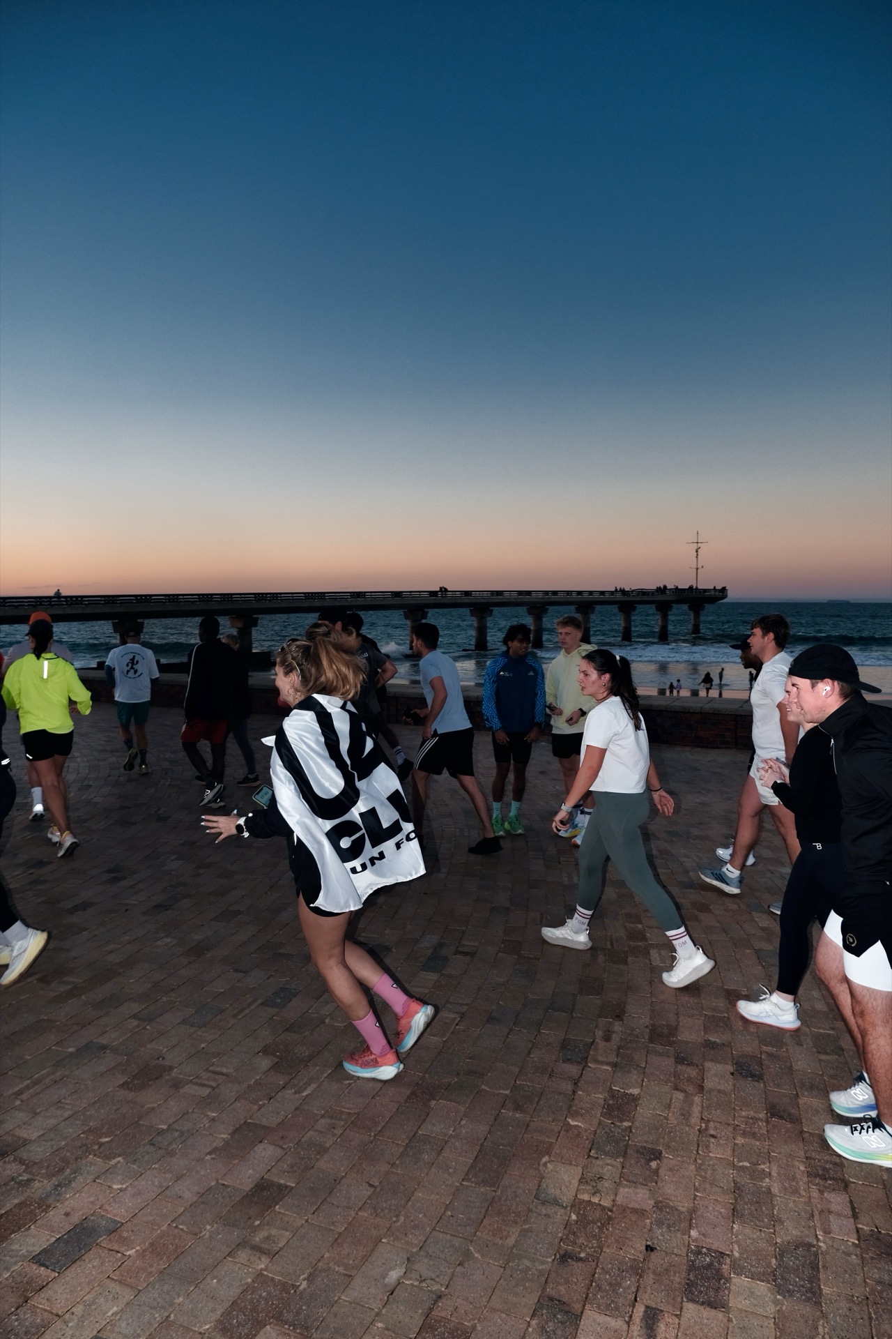 04Runn members socialising on the promenade at sunrise